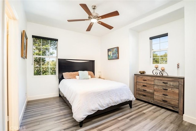 bedroom featuring ceiling fan and hardwood / wood-style flooring