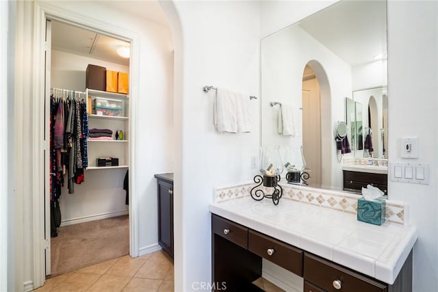 bathroom featuring tile patterned flooring and vanity