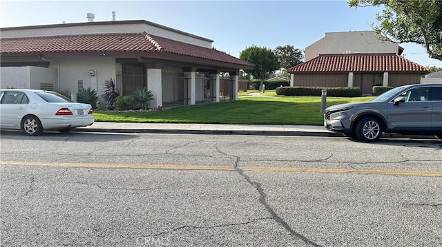 view of side of property with a lawn