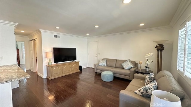 living room with a healthy amount of sunlight, crown molding, and dark wood-type flooring