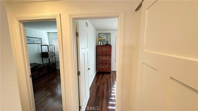 hallway with dark wood-type flooring