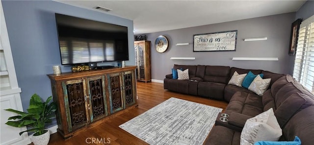 living room with dark hardwood / wood-style floors