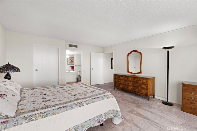 carpeted bedroom with a textured ceiling