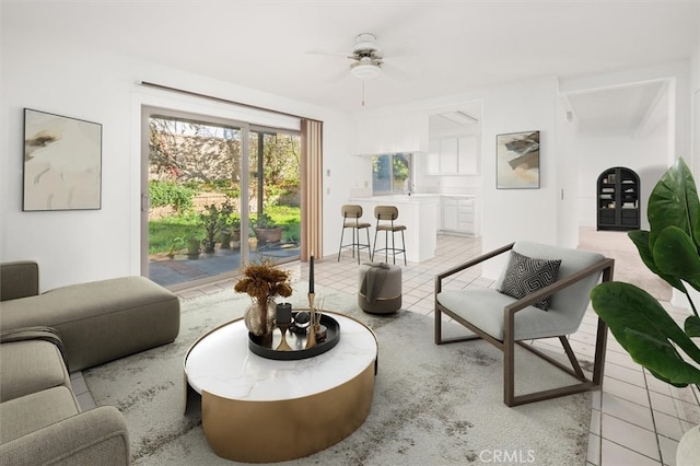 living room featuring ceiling fan and light tile patterned floors