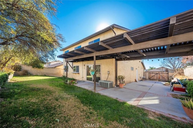 exterior space with a pergola, a patio area, and a lawn