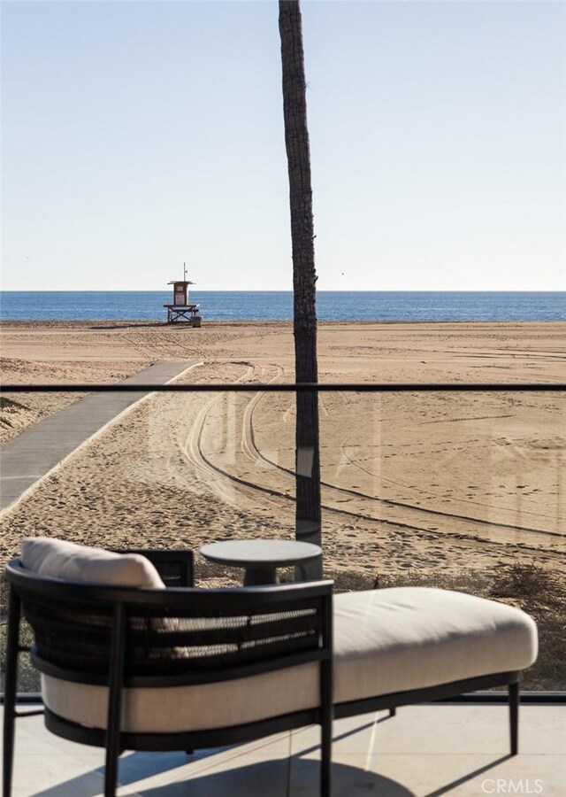 property view of water featuring a beach view