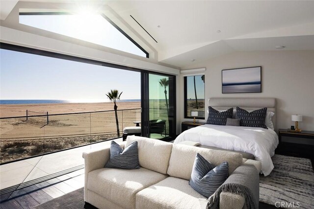 bedroom featuring lofted ceiling and hardwood / wood-style floors