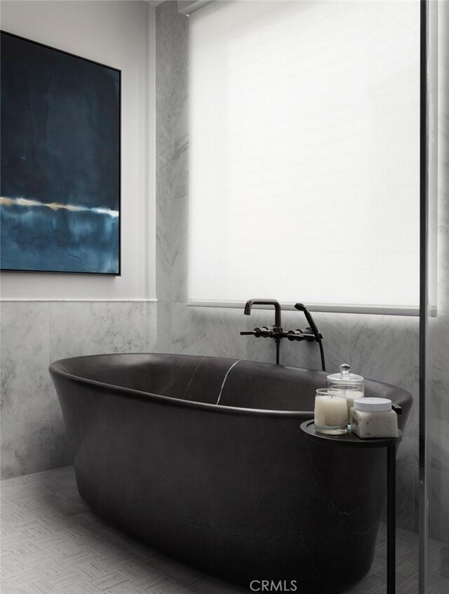 bathroom featuring a tub