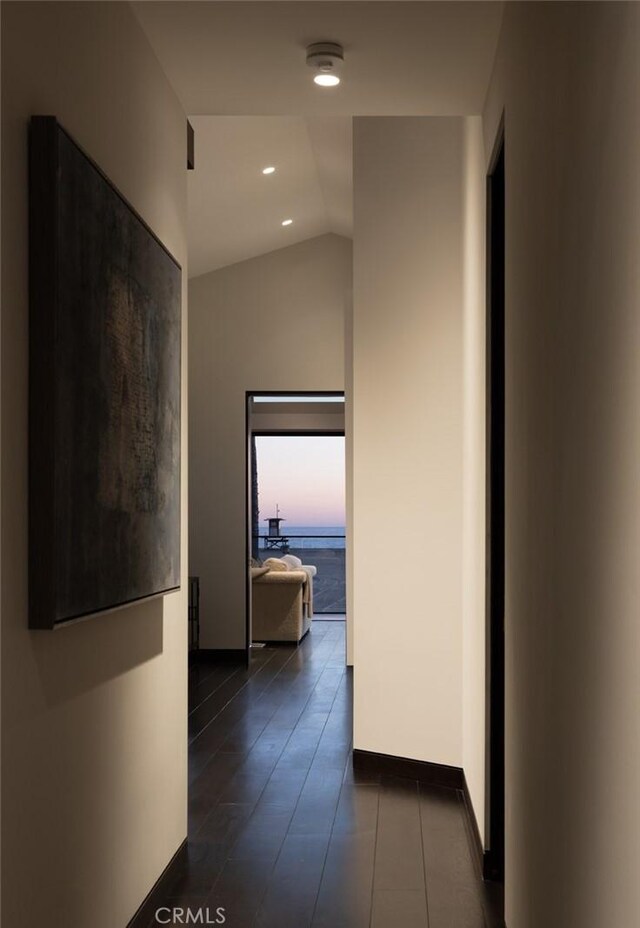 hallway featuring vaulted ceiling