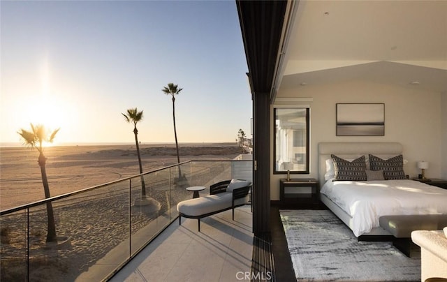 bedroom featuring a water view and tile patterned floors