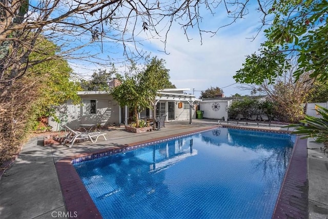 view of pool featuring a patio