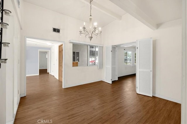 spare room with high vaulted ceiling, dark hardwood / wood-style flooring, beam ceiling, and a chandelier