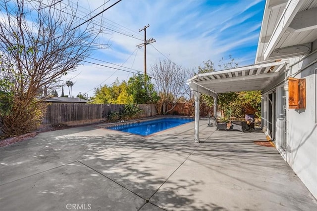 view of swimming pool featuring a patio