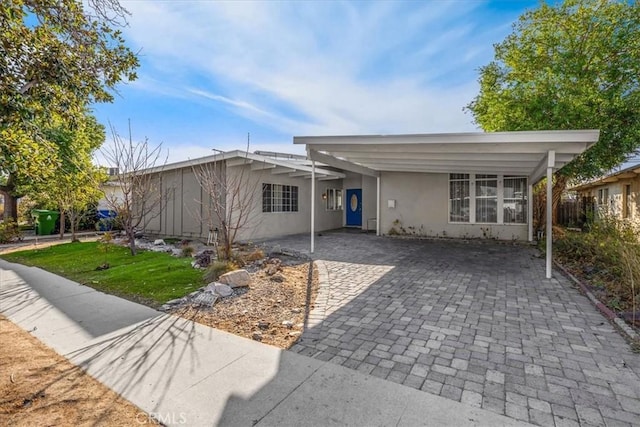 view of front of home with a carport