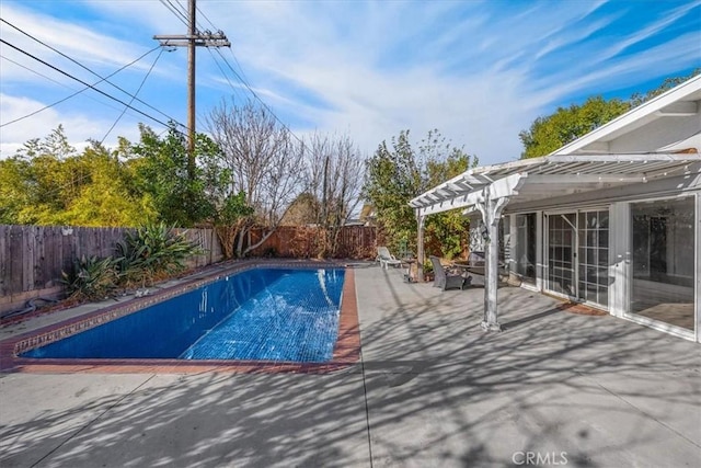 view of pool with a patio area and a pergola