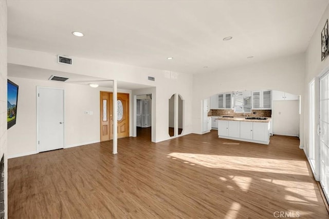 unfurnished living room with hardwood / wood-style flooring