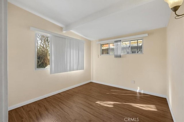 unfurnished room featuring dark hardwood / wood-style floors and vaulted ceiling with beams