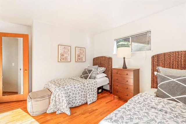 bedroom with wood-type flooring