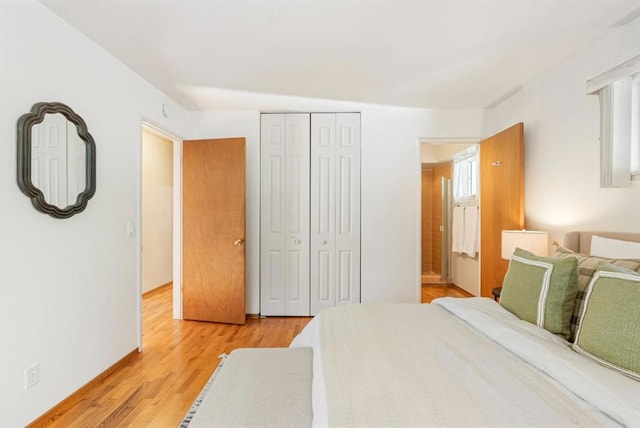 bedroom featuring light hardwood / wood-style floors and a closet