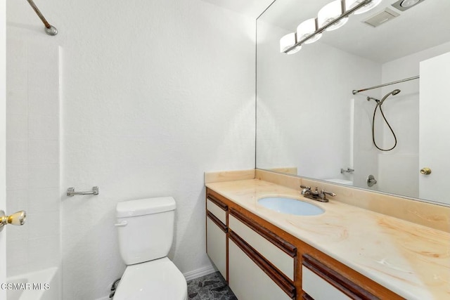 bathroom featuring toilet and vanity