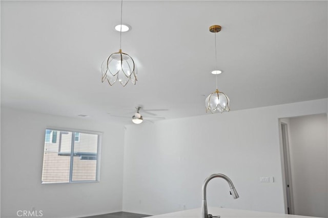 interior space with ceiling fan