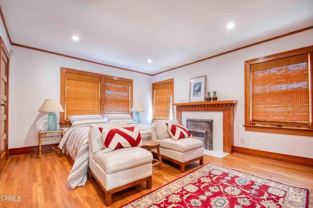 bedroom featuring light hardwood / wood-style flooring and ornamental molding