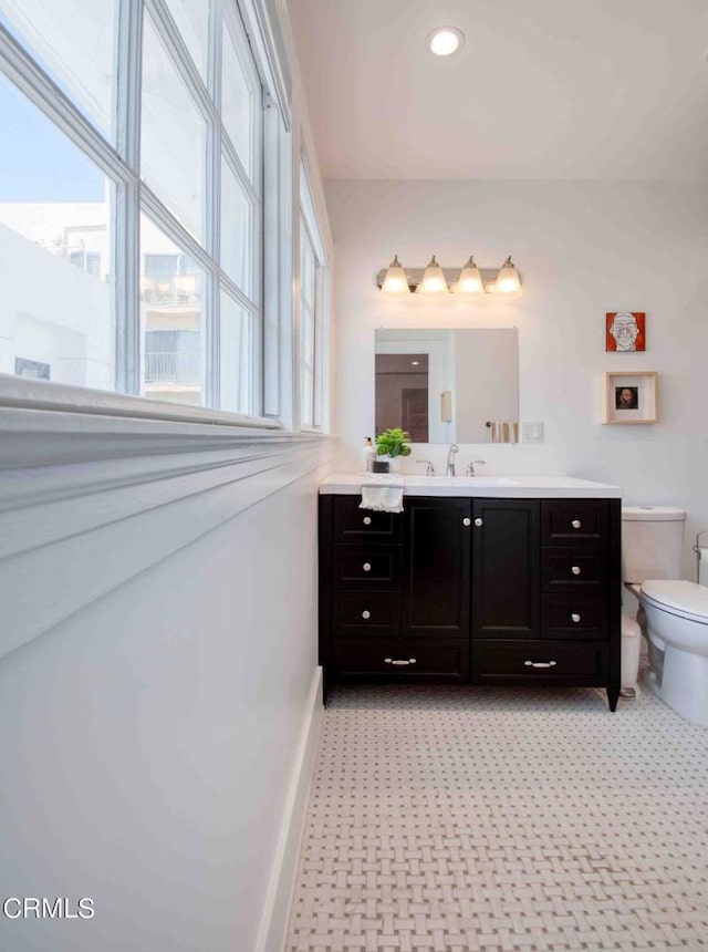 bathroom featuring toilet and vanity