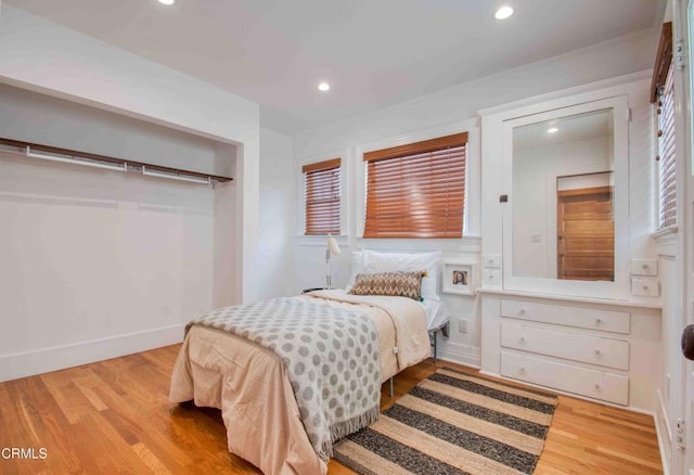 bedroom with light hardwood / wood-style floors