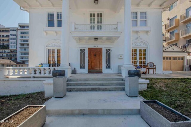 doorway to property featuring a balcony