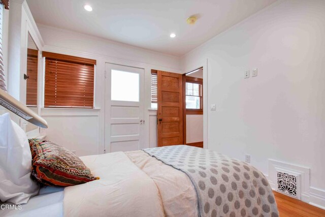 bedroom featuring wood-type flooring