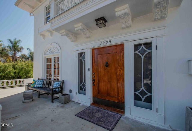 doorway to property with covered porch