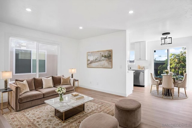 living room with light hardwood / wood-style floors