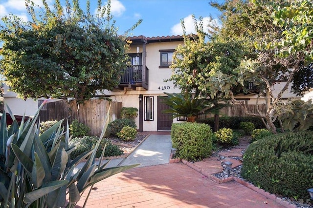 view of front of house with a balcony