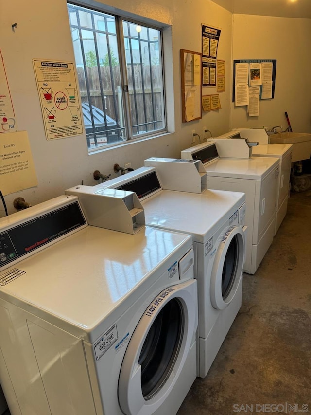 laundry area with sink and washer and clothes dryer