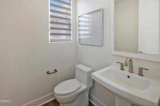 bathroom with toilet and sink