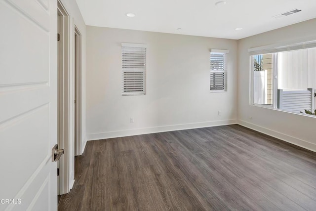 unfurnished bedroom featuring dark hardwood / wood-style flooring