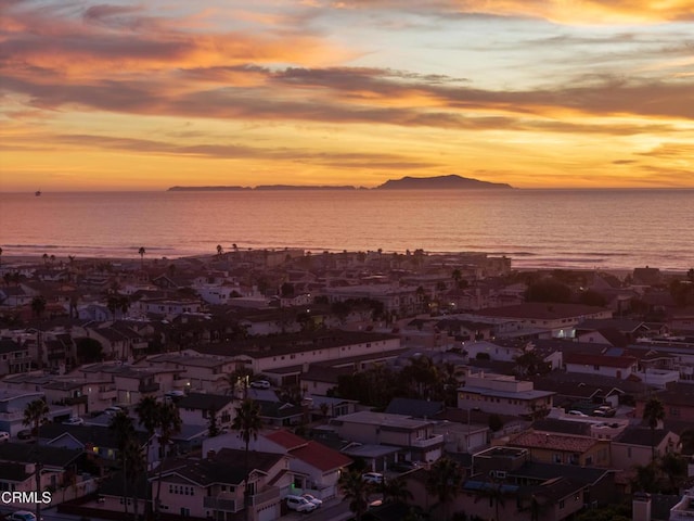 aerial view at dusk with a water view