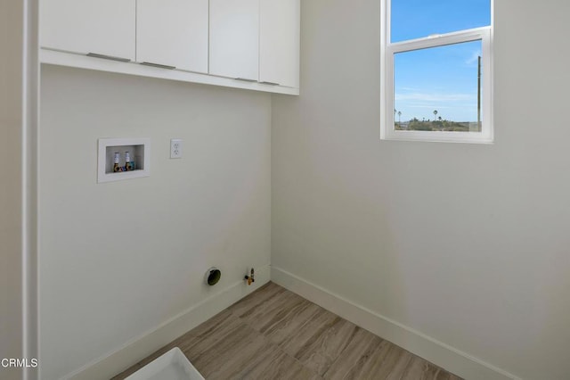 laundry area featuring cabinets, hookup for a washing machine, and hookup for a gas dryer