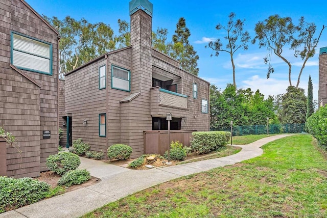 view of home's exterior with a yard