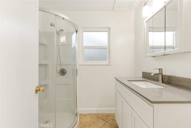 bathroom featuring tile patterned flooring, a shower with shower door, and plenty of natural light