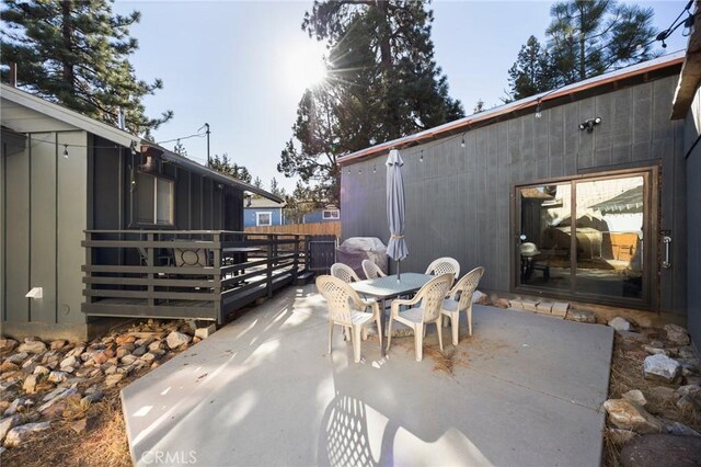 view of patio featuring a sunroom