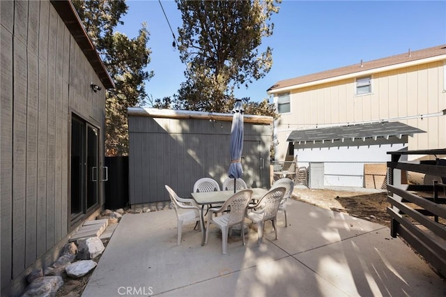 view of patio / terrace featuring outdoor dining area and fence