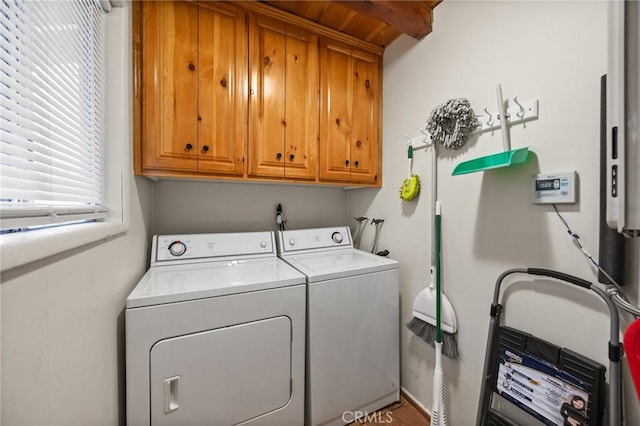 laundry room with cabinet space and washer and dryer