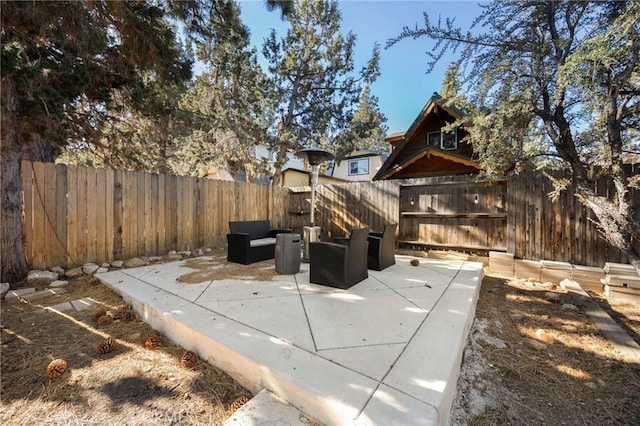 view of patio / terrace featuring a fenced backyard and an outdoor living space