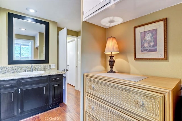 bathroom featuring vanity and wood-type flooring