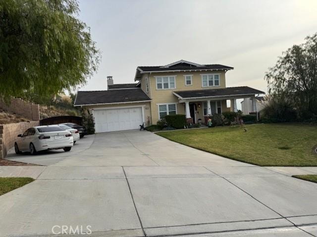 view of front property with a front lawn and a garage