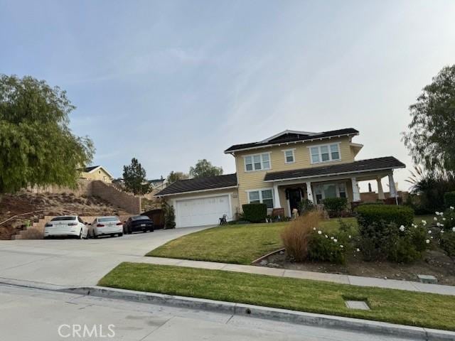 front of property with a garage and a front yard