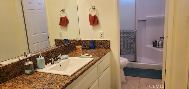 bathroom featuring tile patterned flooring, vanity, decorative backsplash, toilet, and a shower with shower door