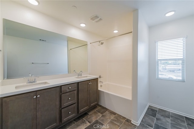 bathroom featuring shower / bathing tub combination and vanity