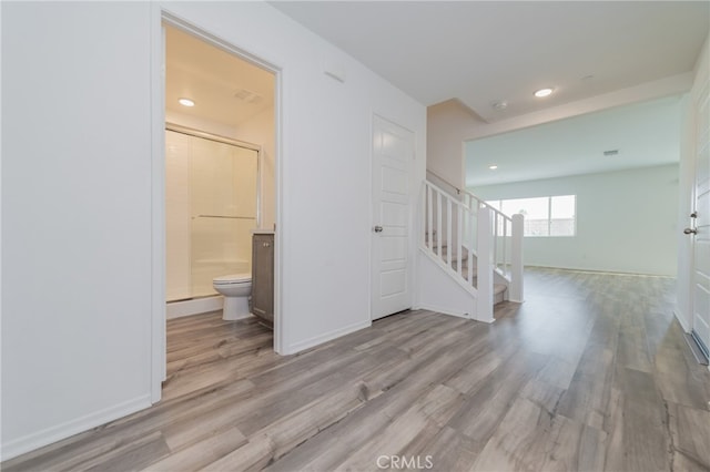 unfurnished room with light wood-type flooring